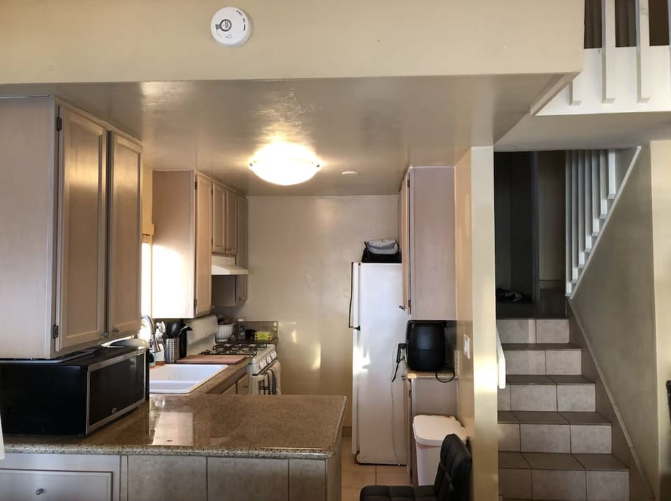 Kitchen & living room on one level with bedrooms on others for privacy.