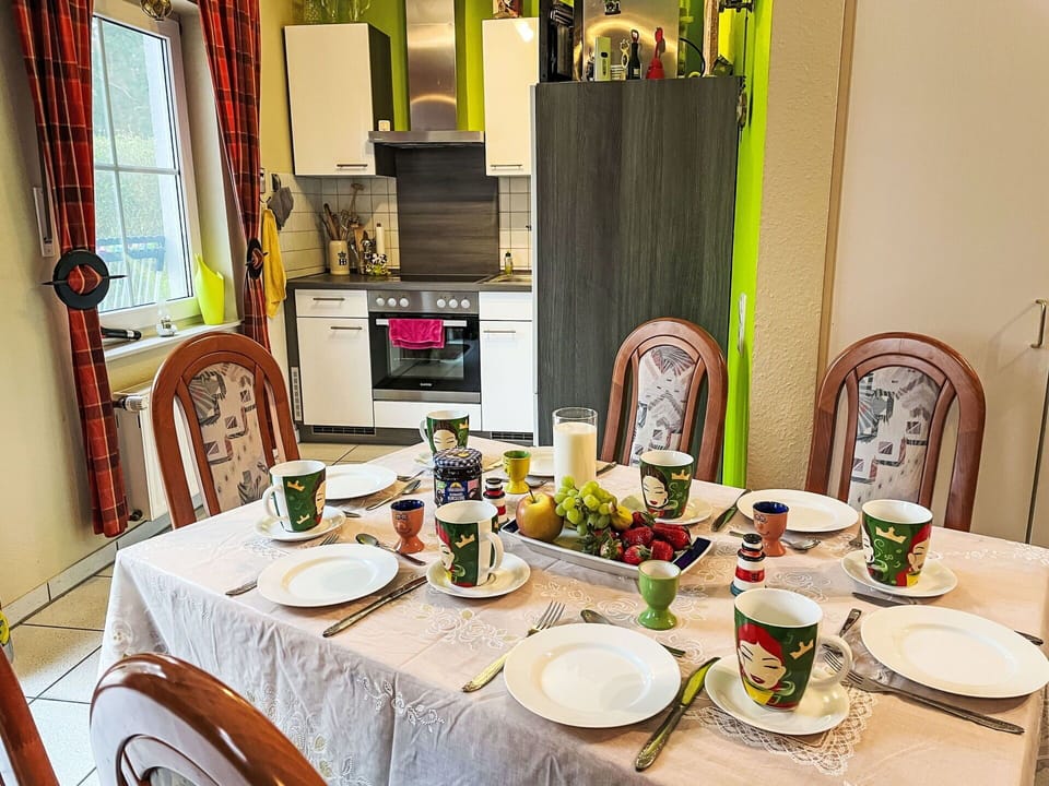 Furniture, Interior Design, Tableware, Table, Chair, Kitchen & Dining Room Table, Dining Room, Lighting, Room, Serveware