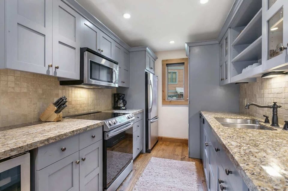 Updated, fully-stocked kitchen with plenty of space for cooking.