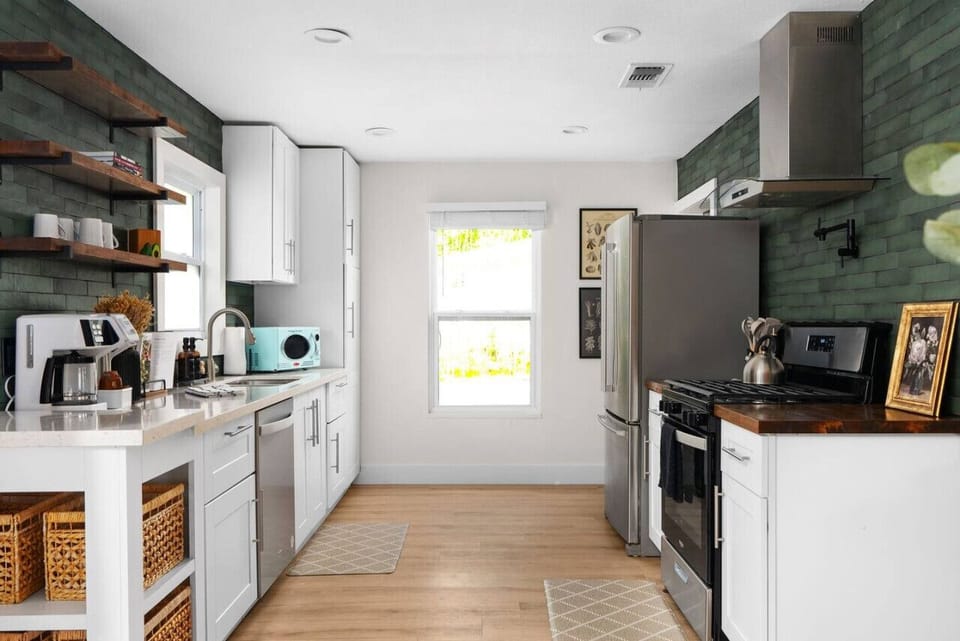 Step into a kitchen that blends form and function with a nod to classic mid-century design. Fully equipped with modern appliances, sleek countertops, and all the essentials,
