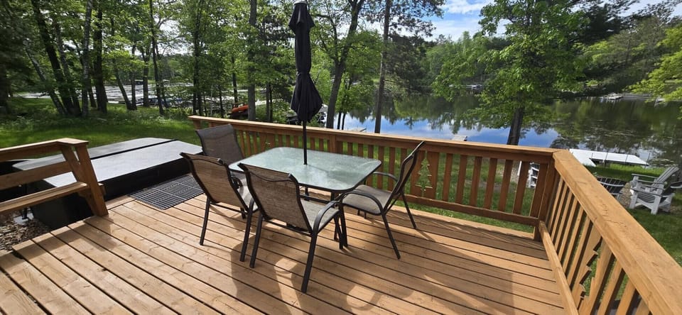 Host elegant outdoor meals with breathtaking water views from your private, expansive wooden deck.