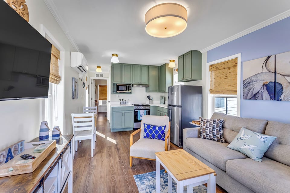 Open concept living, dining and kitchen areas.