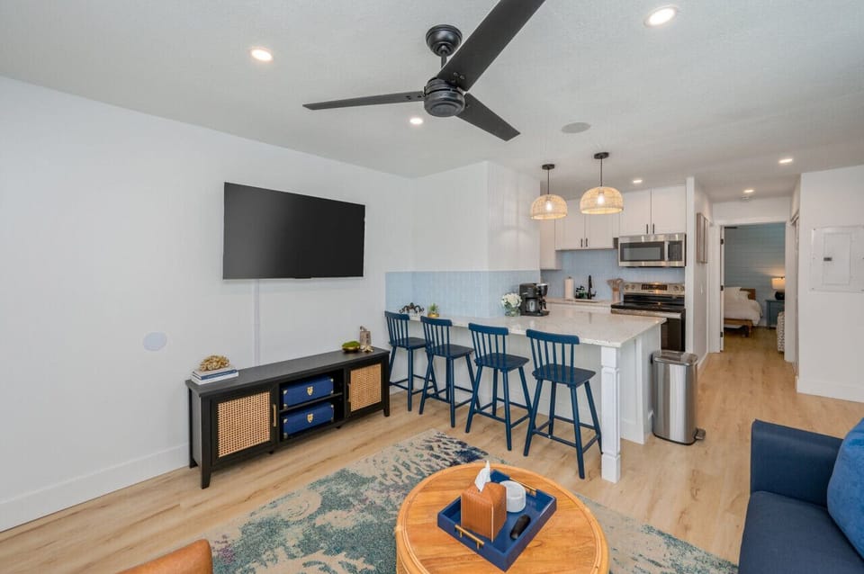 Open-concept living space with the kitchen just beside the cozy living room, creating a seamless flow for both cooking and relaxation.