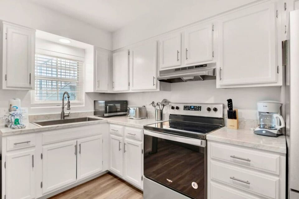 Indulge in preparing your favorite meals in this fully equipped kitchen, stocked with all the necessary tools for culinary creations