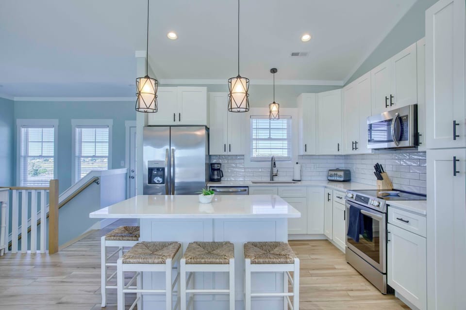 Kitchen with island seating for 4. Beautiful sound and intercoastal views.