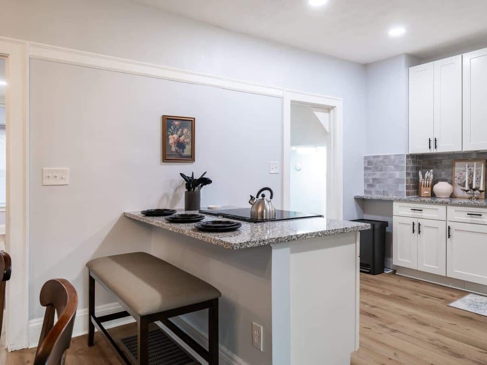 Modern kitchen island w/ bar seating & open flow into the living area