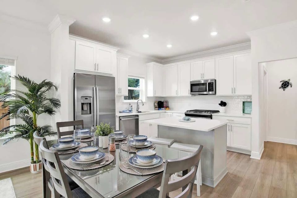 {DINING ROOM} Seamlessly connects to both the kitchen and living room in an open floor plan,creating an ideal flow for entertaining and family meals. This space allows for easy interaction, with natural light enhancing the warm, inviting atmosphere.