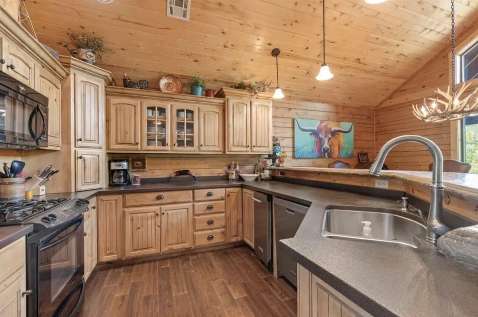 Kitchen with gas stove and ice maker