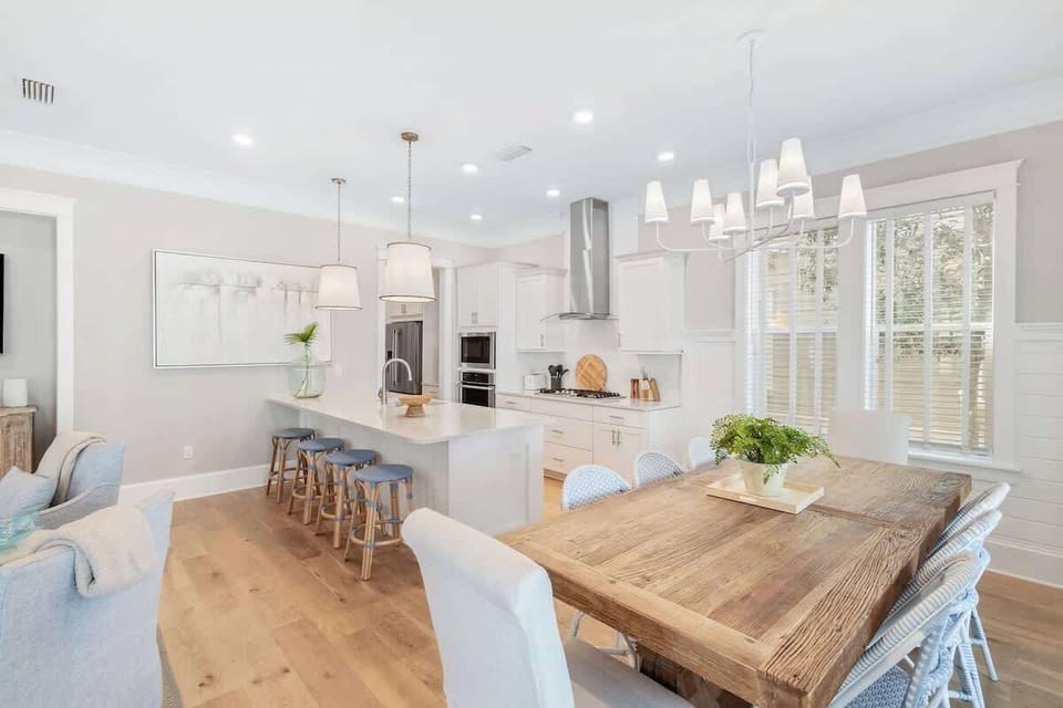 Dining room table feature seating for 8, with an additional 4 seats at the large kitchen island.