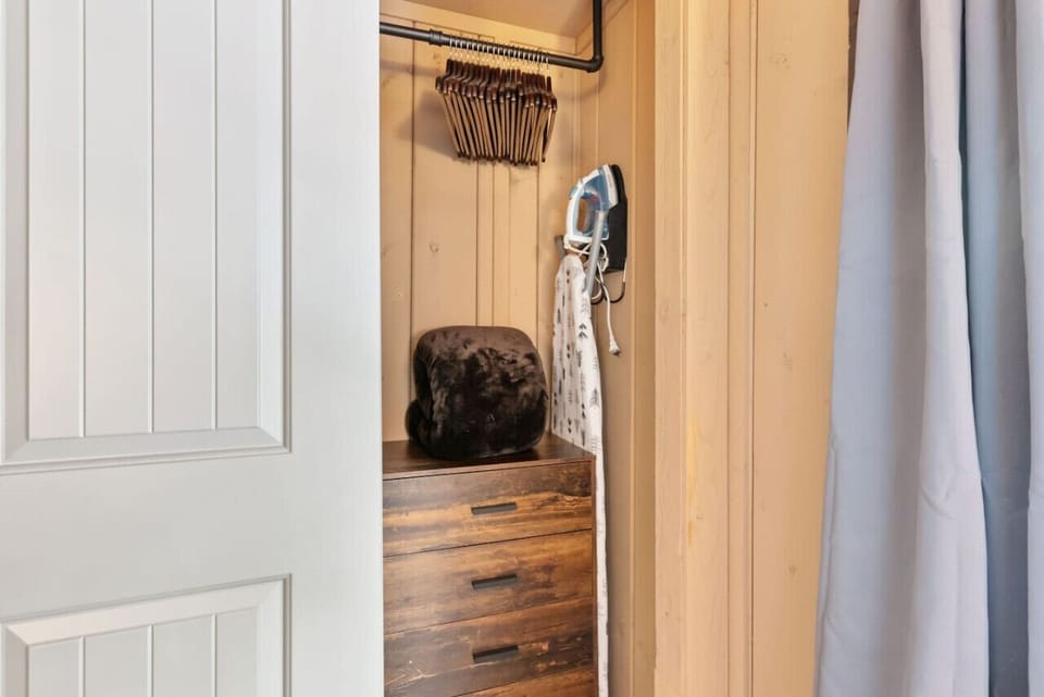Iron, Ironing Board, Hangers, Small Dresser, Extra blanket in Main level Bedroom