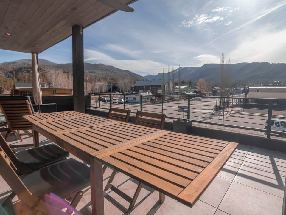 The upper deck offers ample seating, an outdoor dining table, and a grill for outdoor relaxation!