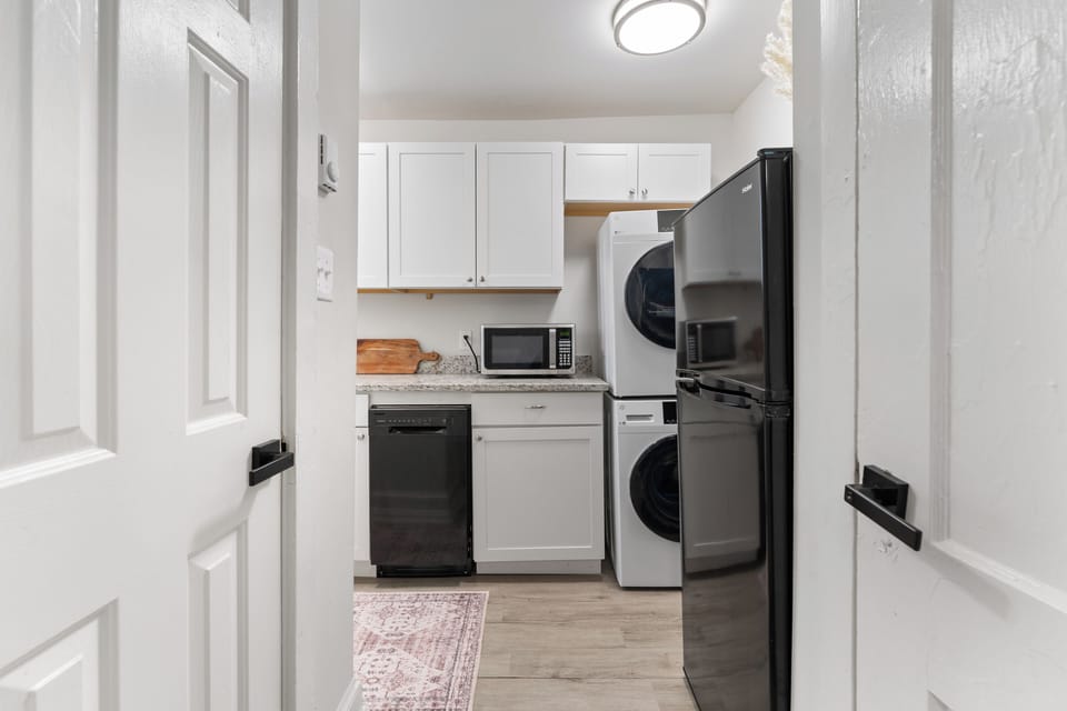 This kitchen features sleek appliances, ample counter space, and full equipment.