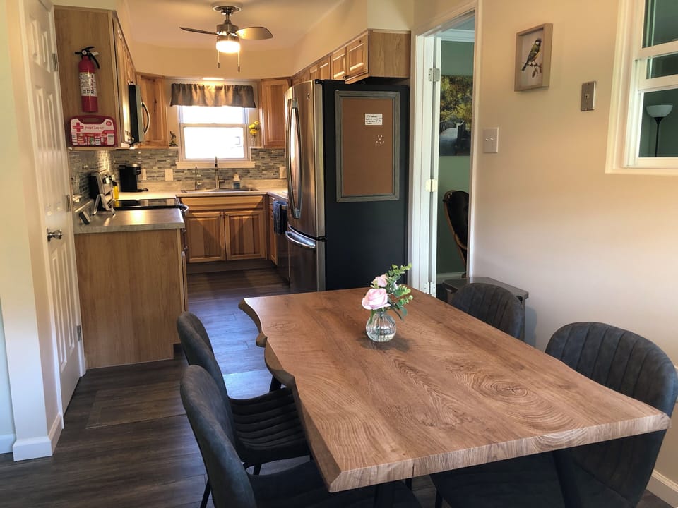 eat in kitchen with table and four chairs