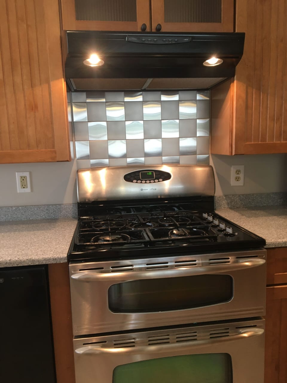 Your conventional propane cook stove and bake ovens. Dinnerware in cabinets.