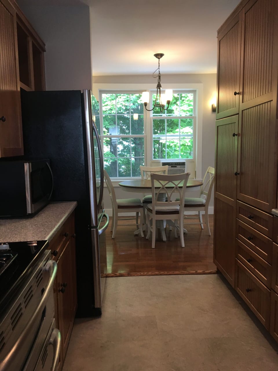 Your dining area. A large pantry cabinet provides convenient storage.