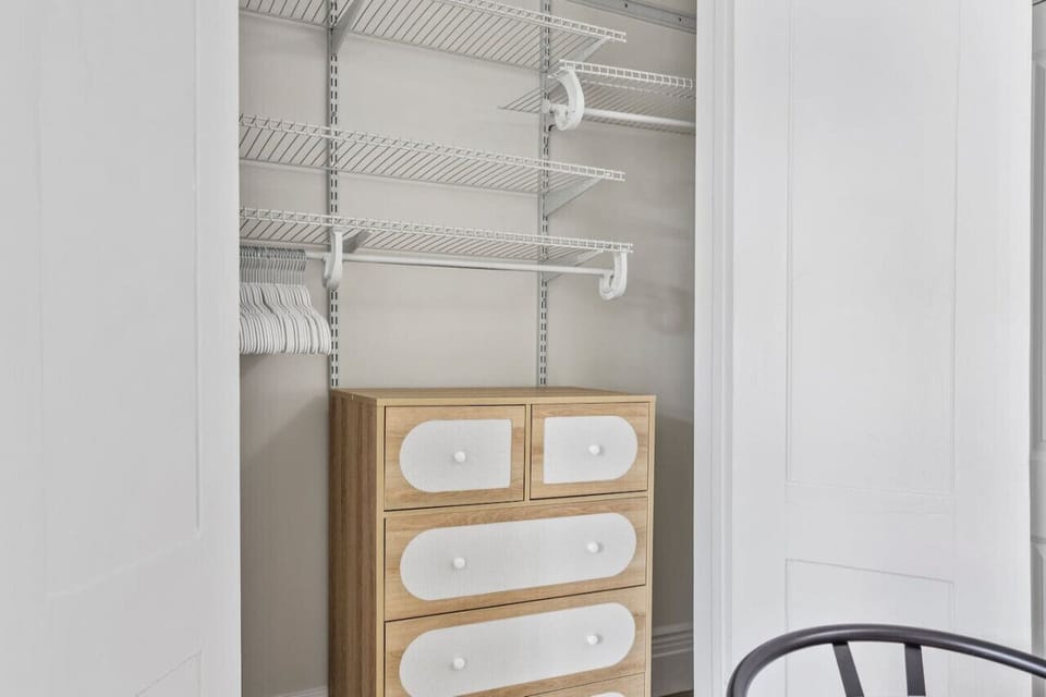 Convenient and functional clothing rack with wooden cabinet