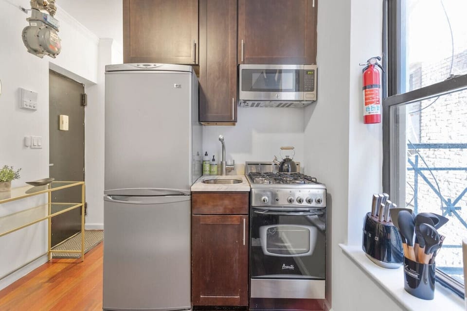 Fully equipped kitchen from cookware to appliances.