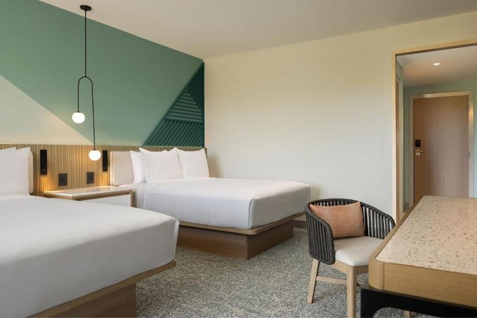 Stretch out comfortably with generous space around two plush beds.