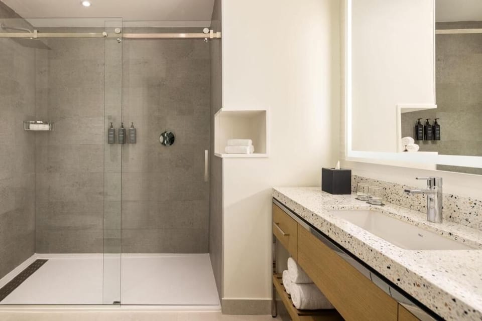 Refresh in a spotless walk-in shower with luxe toiletries.