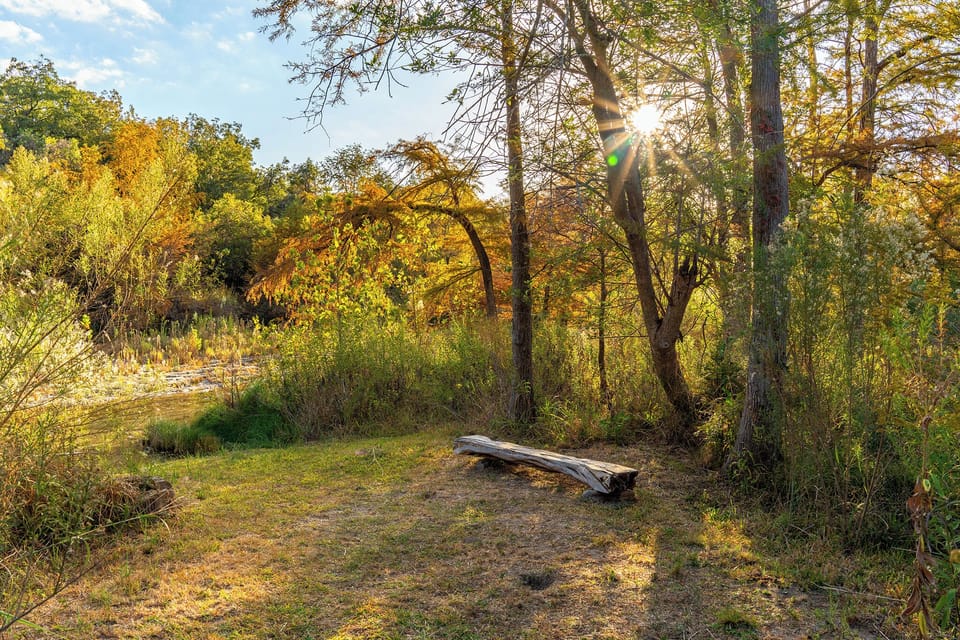Relax by the peaceful banks of the Blanco River, just steps from your door.