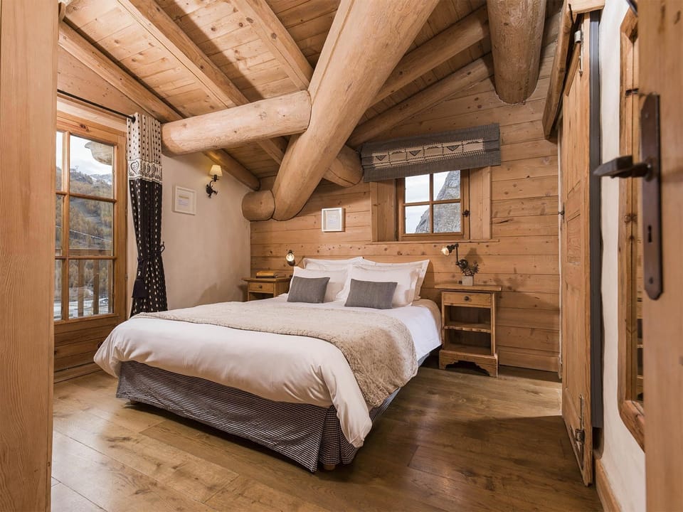 Get a peaceful night sleep in our cozy bedroom. - Bedding configurations vary!