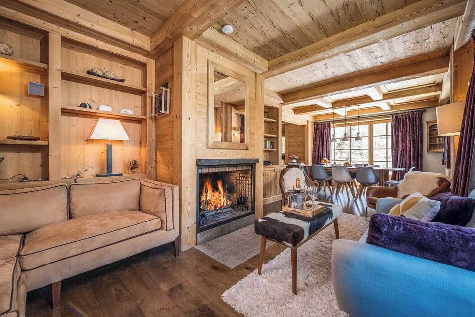 Take a seat in front of the fireplace and enjoy the living area.