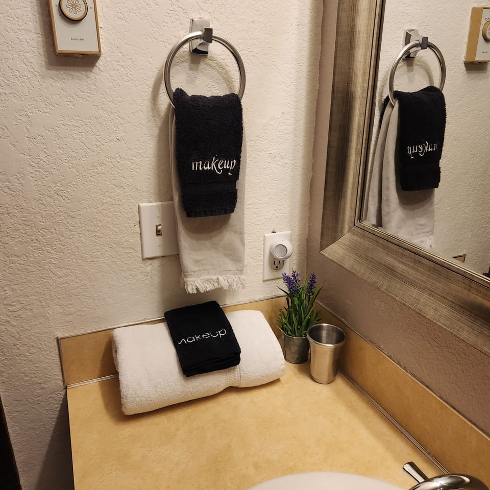 bathroom with a double headed shower.  no bathtub.  located downstairs 