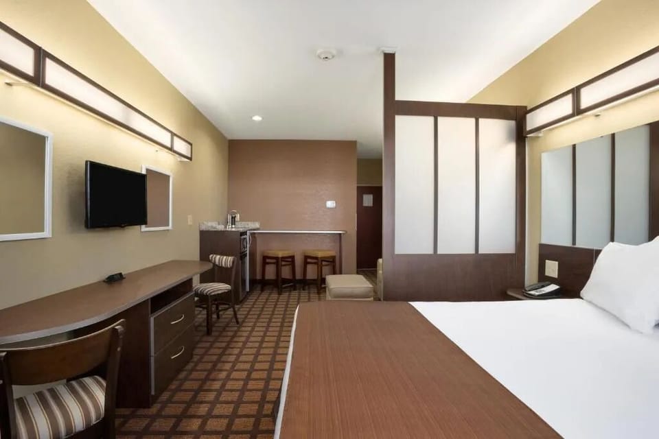 Relax in a spacious layout with desk, seating, and comfort.