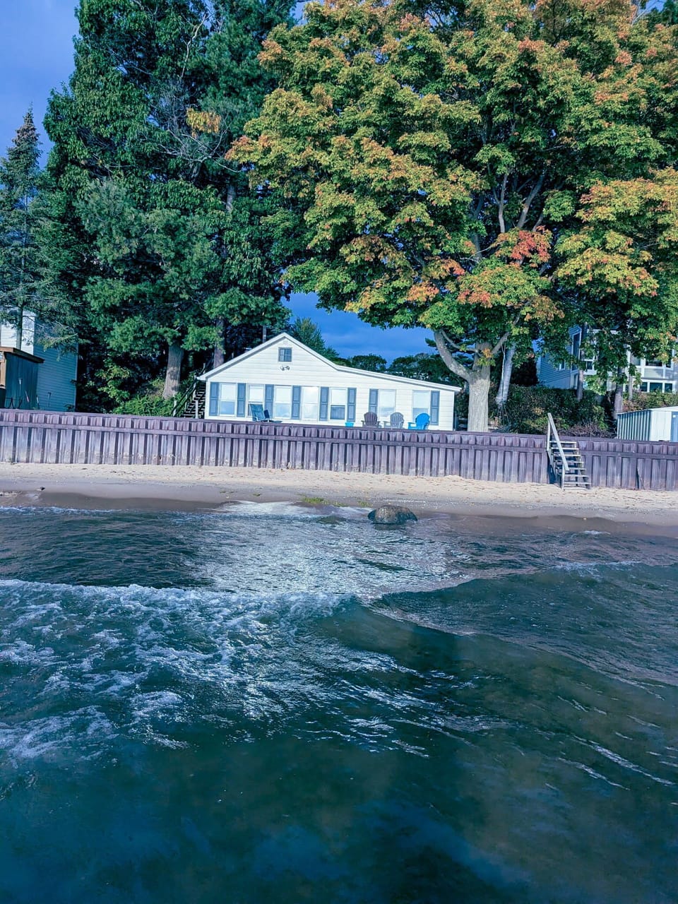 OVERALL:   Aerial view of the beach house, seawall, and private beach.