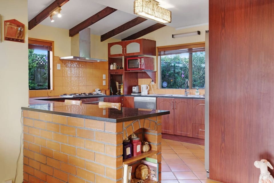 On the other side of the kitchen island there is some bar leaners which are great for casual dining.