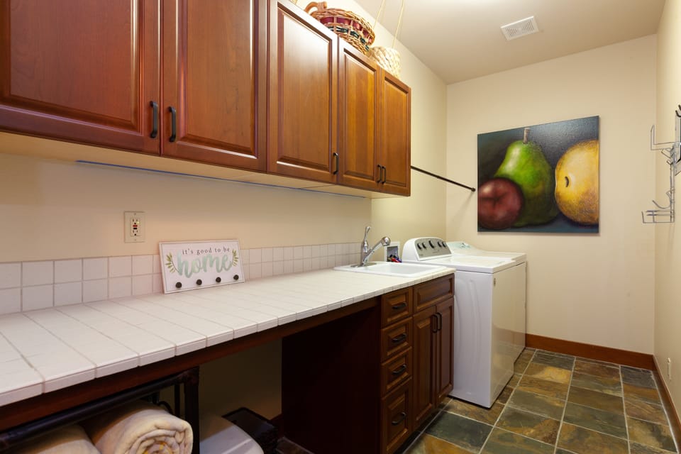 Spacious in home laundry with detergent and supplies provided