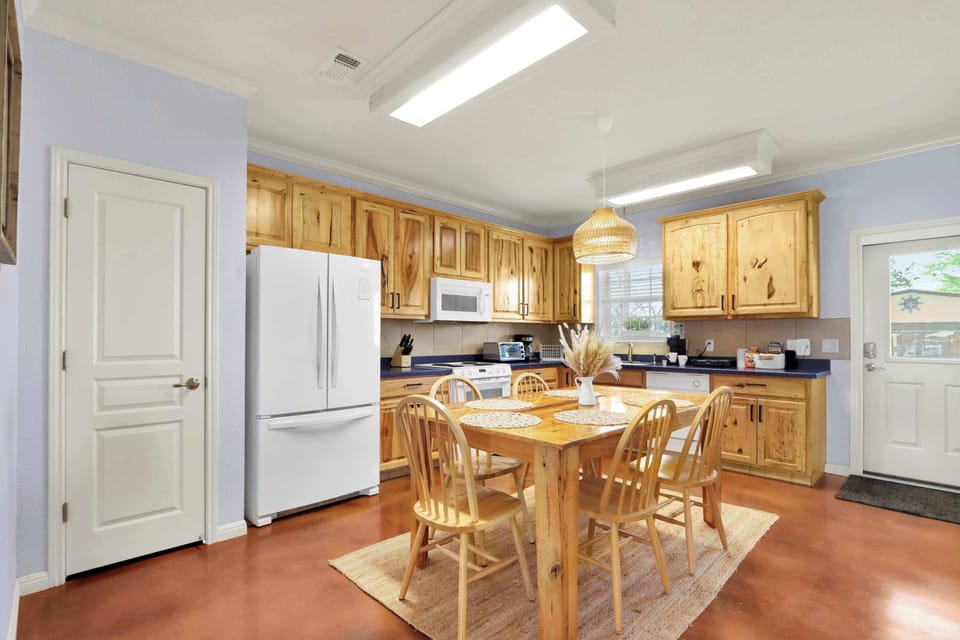 The spacious eat-in kitchen is well equipped for your visit to New Braunfels
