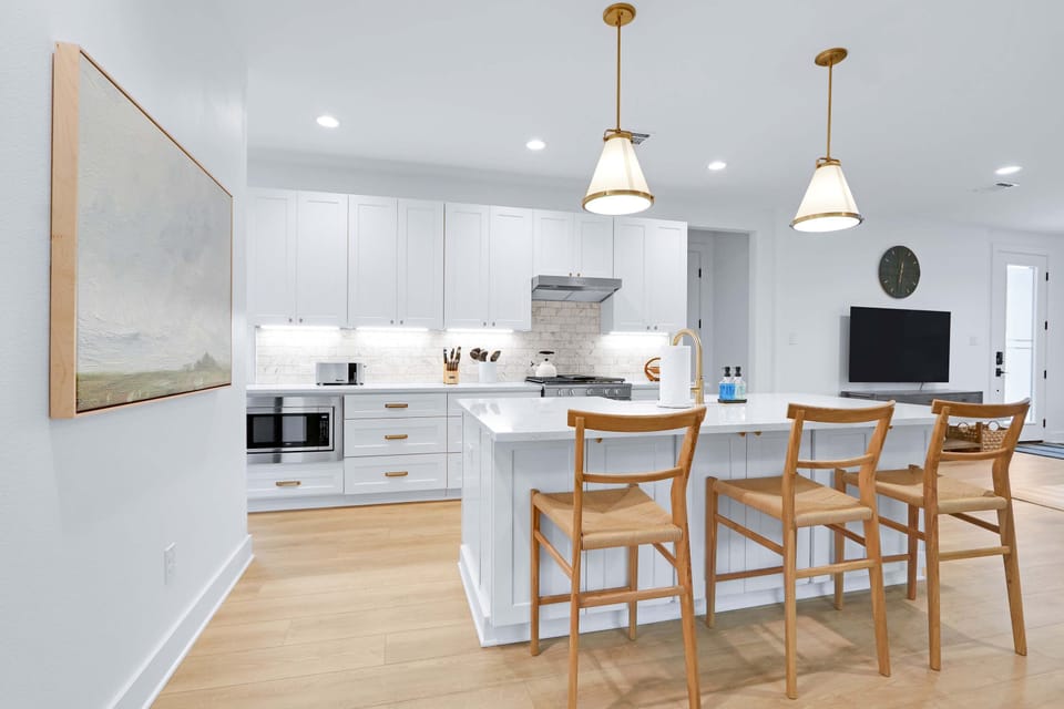 Gather for meals together at the dining table or sip coffee at the kitchen island