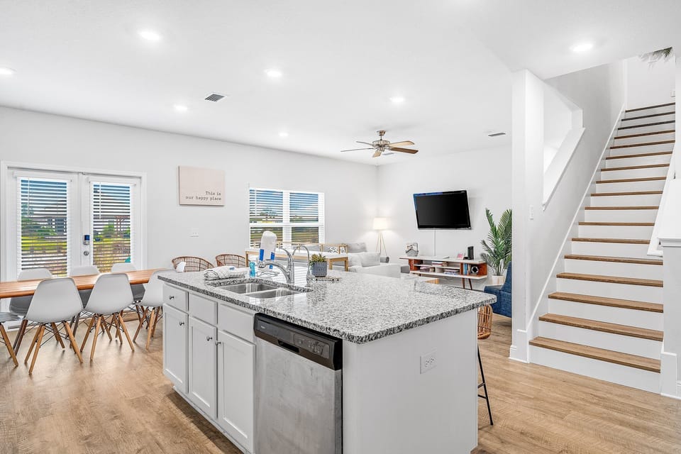 Your modern open-concept space flows from kitchen island to cozy living area, where you can cook, dine, and relax together.