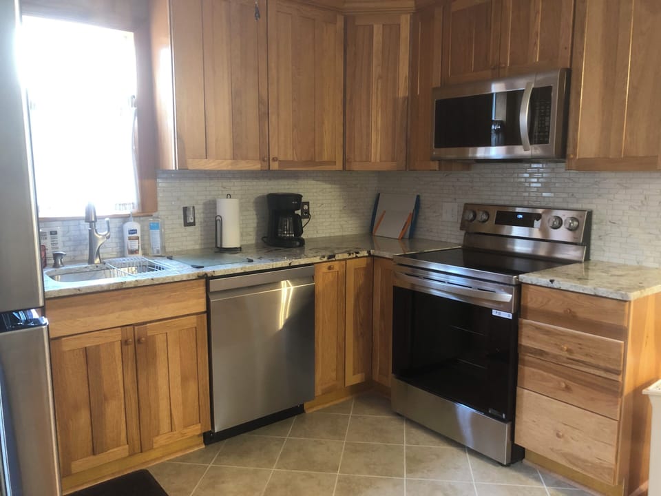 Full service kitchen with basic cooking supplies provided.