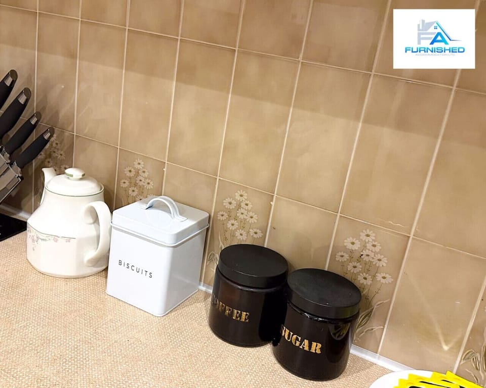 Well-stocked kitchen area featuring a kettle, coffee service, and cooking essentials. Everything you need to prepare beverages and meals is thoughtfully provided for your convenience.