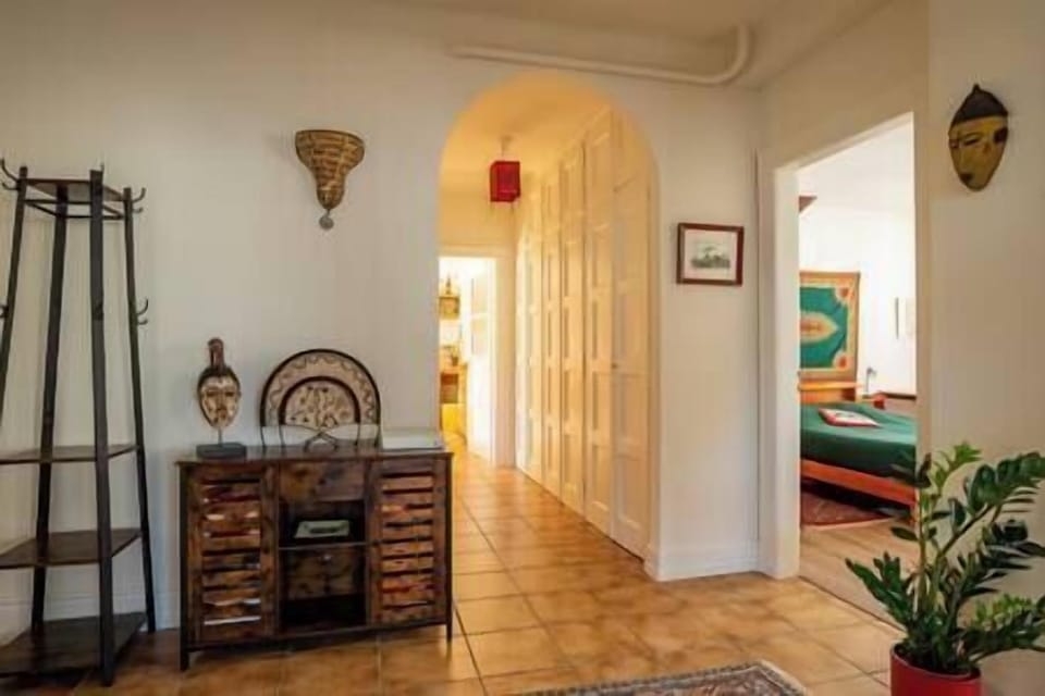 At the end of the corridor, the kitchen and the bathroom 