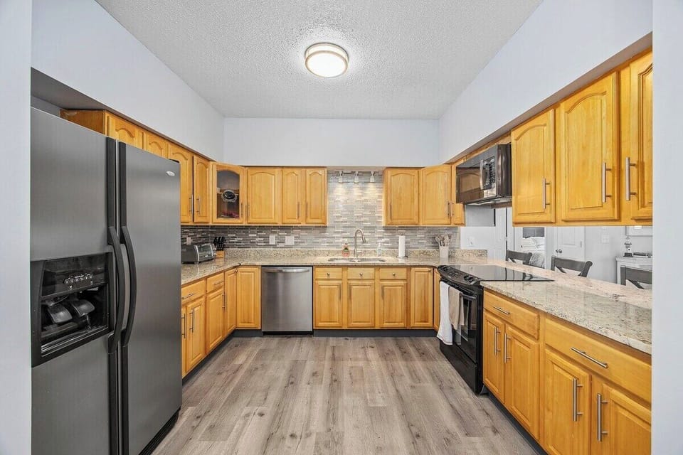 Enjoy easy meals in a fully equipped kitchen with open dining space