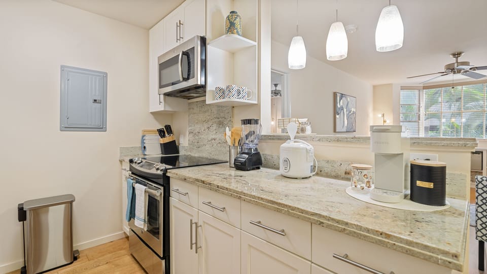 Full kitchen includes range, microwave, dishwasher, toaster, blender, rice maker, Keurig, knife set, cutting boards, cooking utensils, plates, dishes, glasses, mugs, kitchen towels, utensil set, chopsticks, kid-friendly utensil set, basic starter kit of coffee, sugar, salt/pepper.