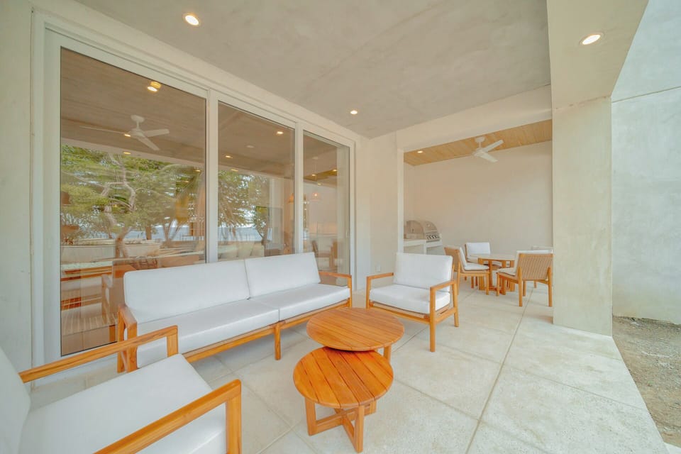 private porch with pool and ocean views