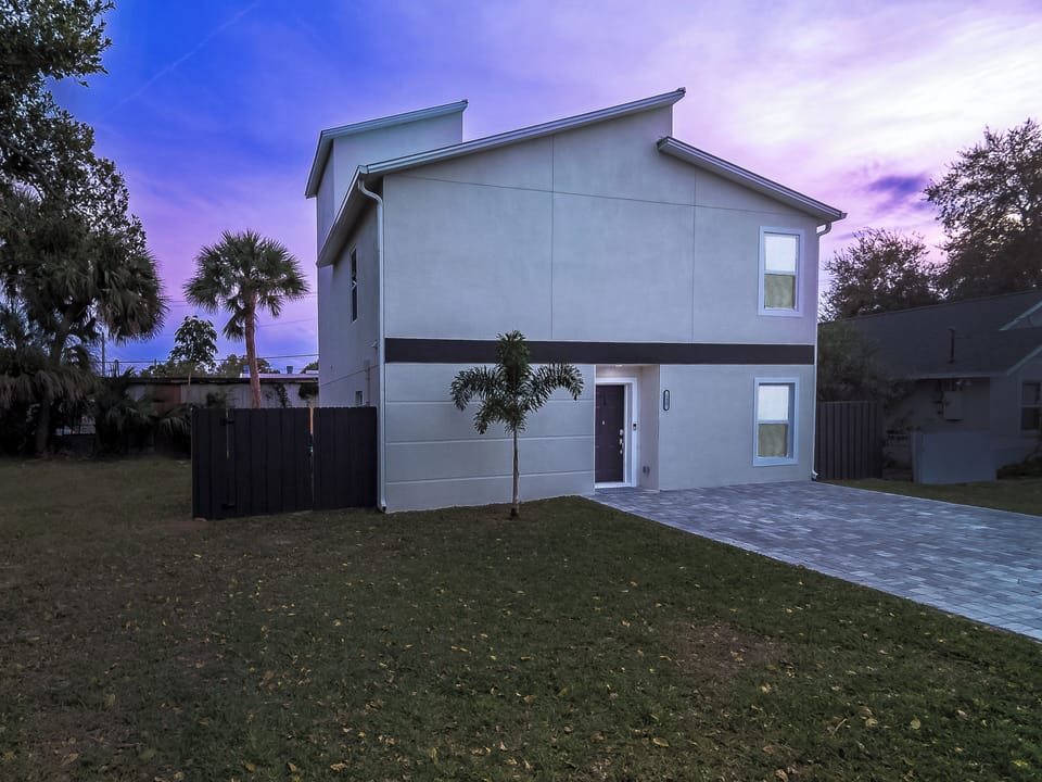 Parking for up to 4 cars with an enclosed backyard patio.