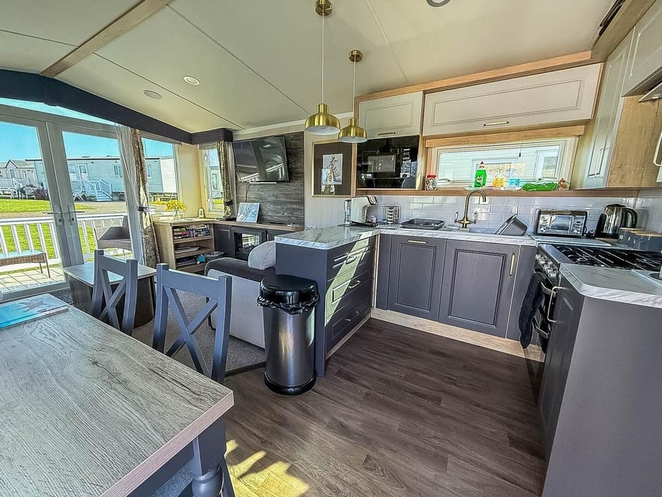 Discover the perfect staycation at Hopton Holiday Village Norfolk, where you can enjoy the stunning Norfolk coast and relax in a cosy static caravan holiday with a comfortable kitchen area.