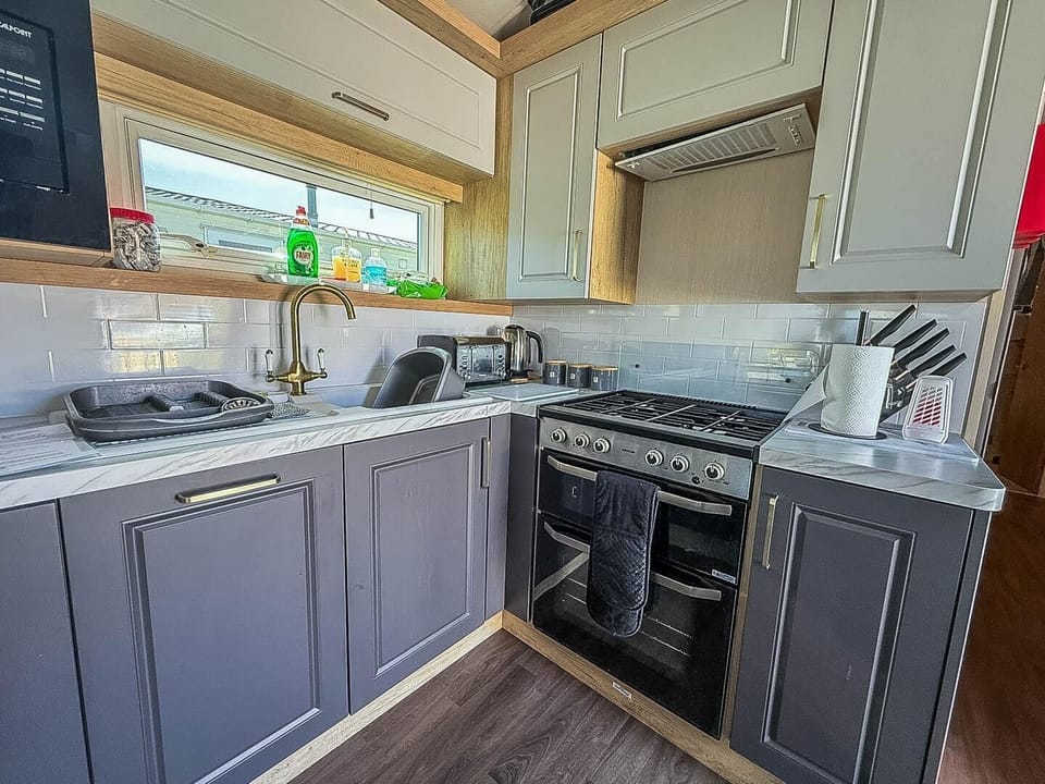 After a day of sun and sand at Great Yarmouth beach, retreat to your static caravan holiday at Hopton Holiday Village Norfolk, complete with a cosy kitchen area.