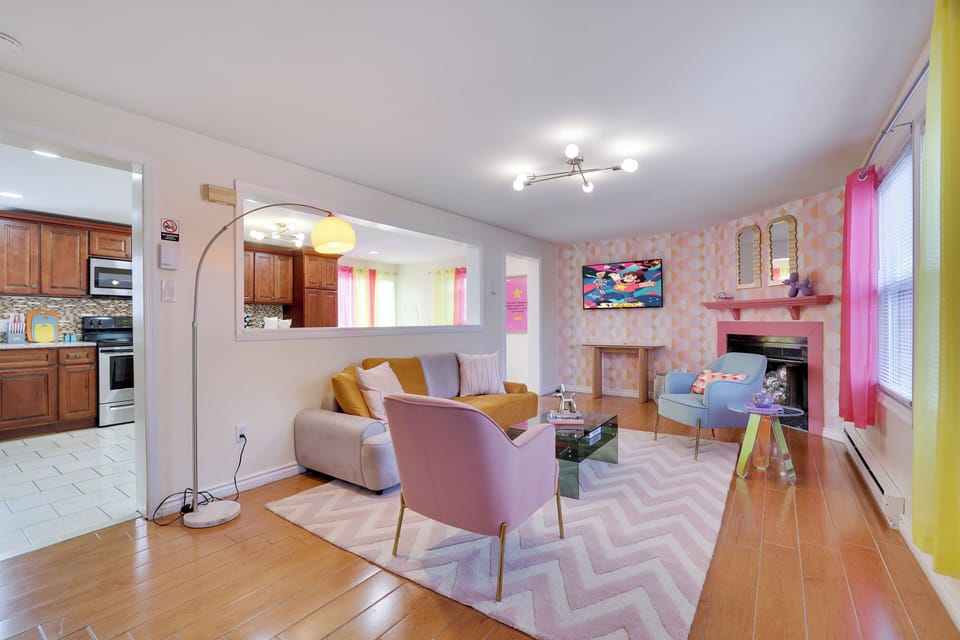 Living Room: A colorful, retro-inspired living room with pastel furniture 