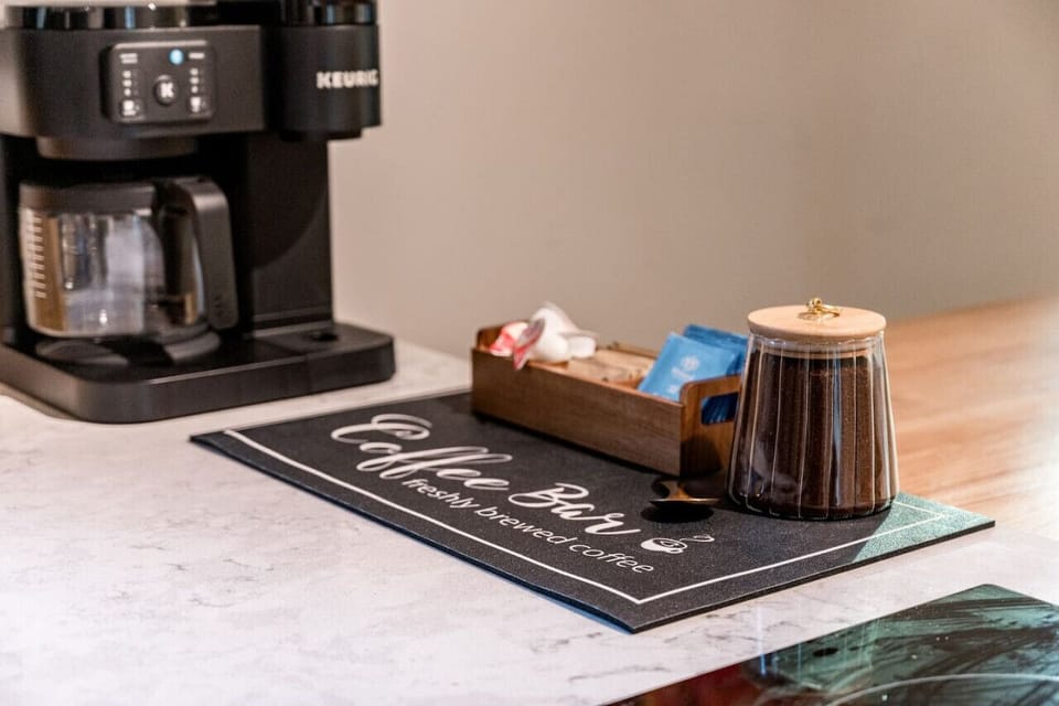 Luxury coffee maker with dual drip and K-cup functionality.