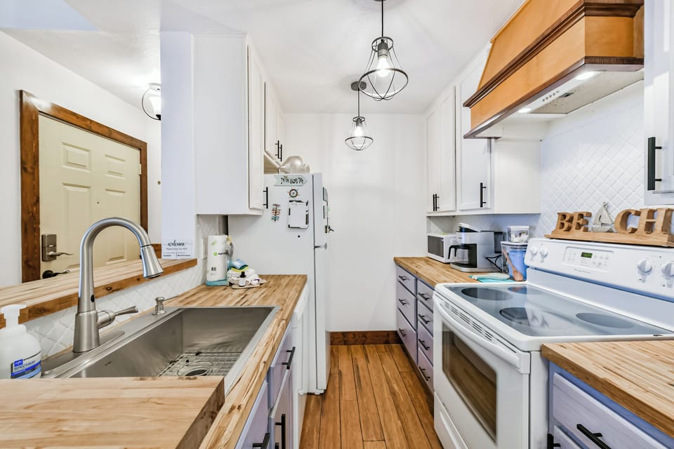 GALLEY STYLE KITCHEN OPEN TO THE LIVING AREA