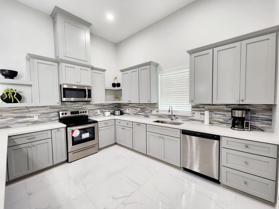 Large open kitchen with cooking essentials 