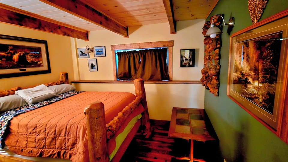 Queen bed with step stool, table for luggage, phone charger