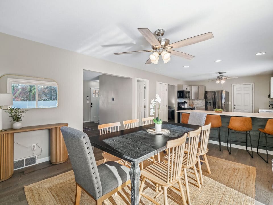 Elegant simplicity defines this dining room, with its muted tones and natural textures, creating a serene ambiance.