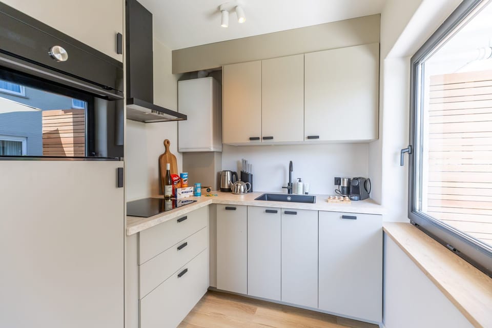 Modern kitchen with clean white finishes. 🔪